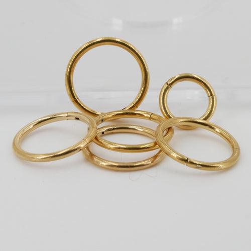 Product picture many gold piercing ring clickers 16 gauge titanium 